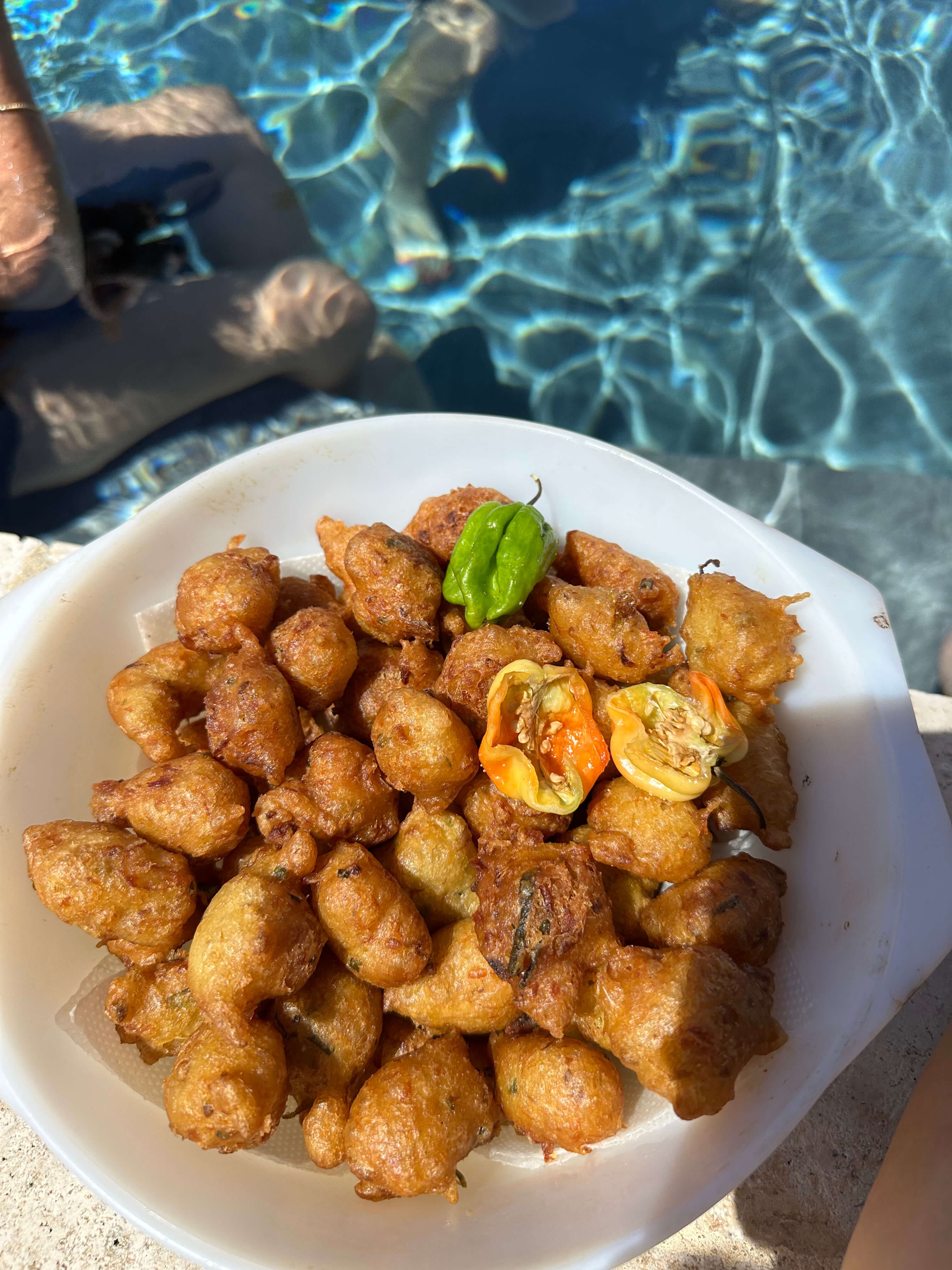 Plate of accras enjoyed by the water in Martinique