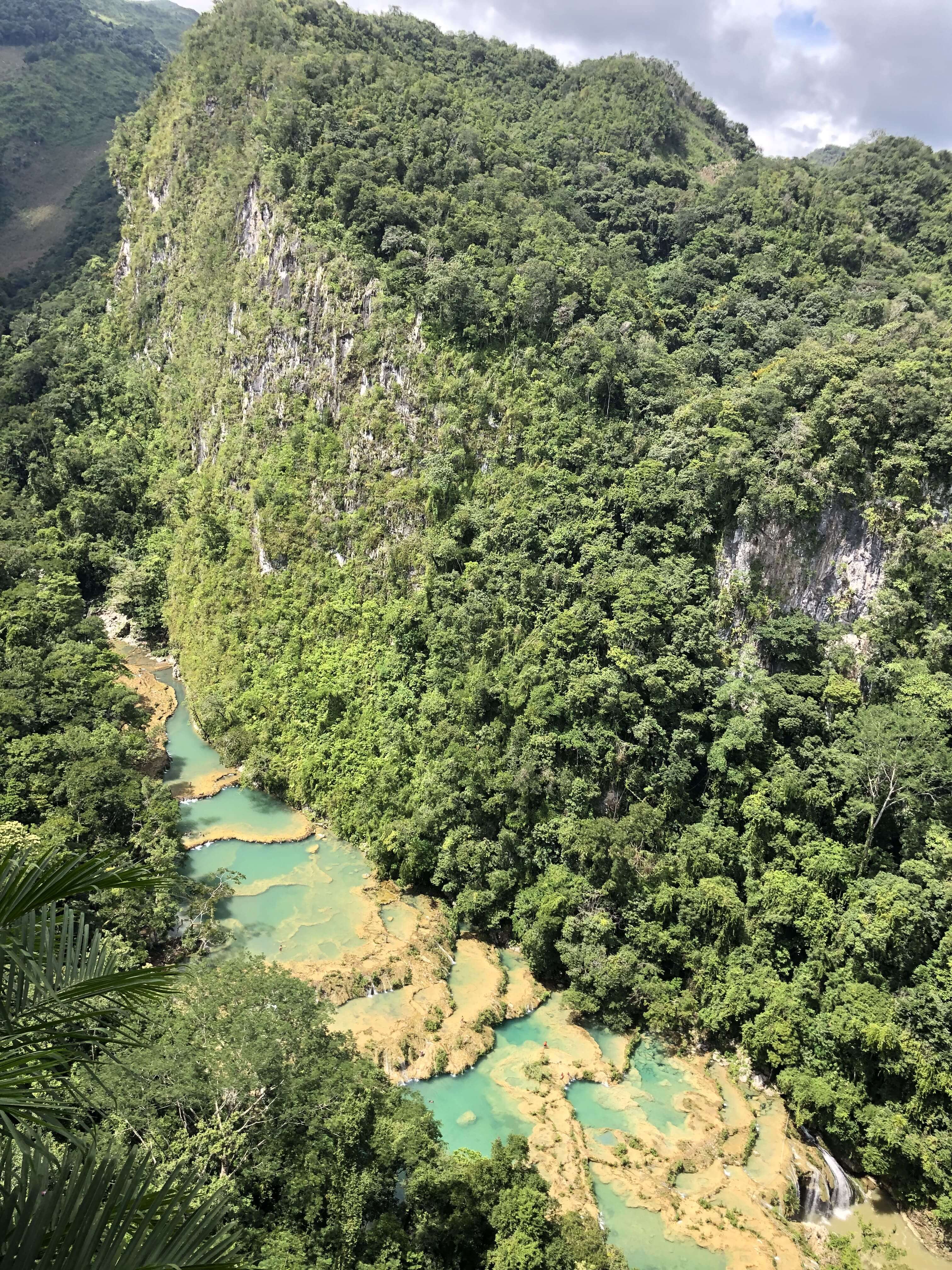 Turquoise pools of Semuc Champey seen from the viewpoint in Guatemala