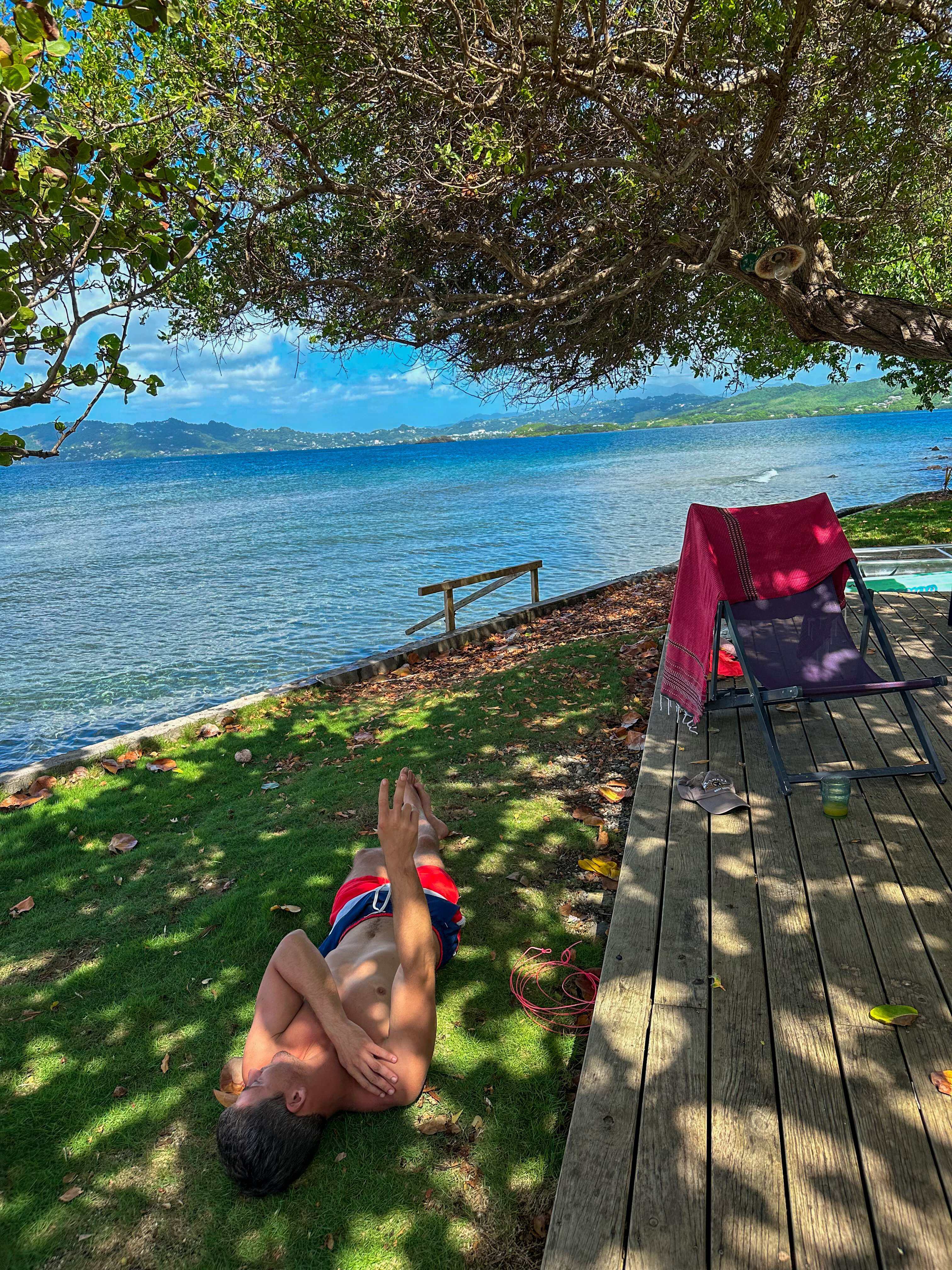 Relaxing by the water under the trees