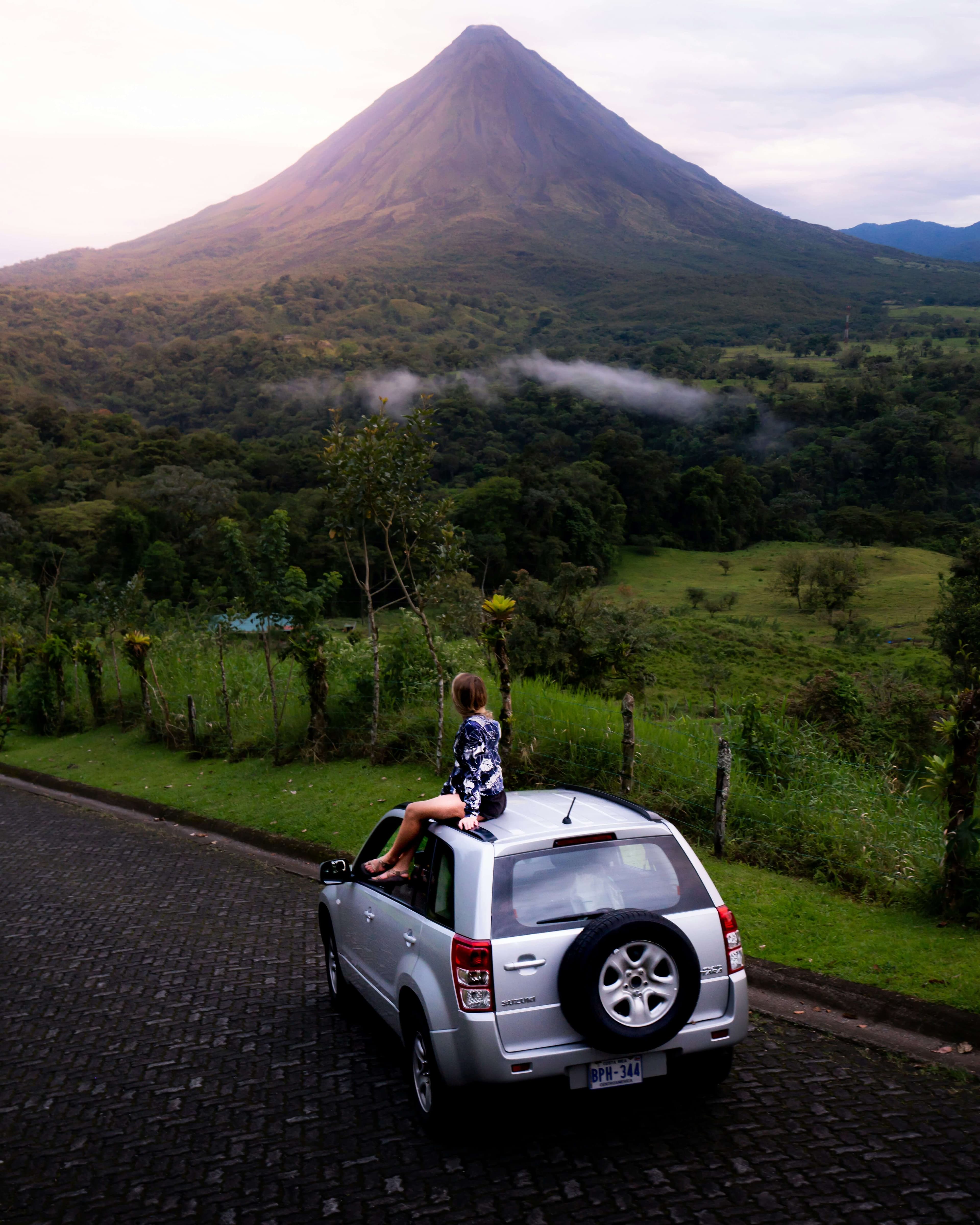 Green volcano in Costa Rica under a tropical sky